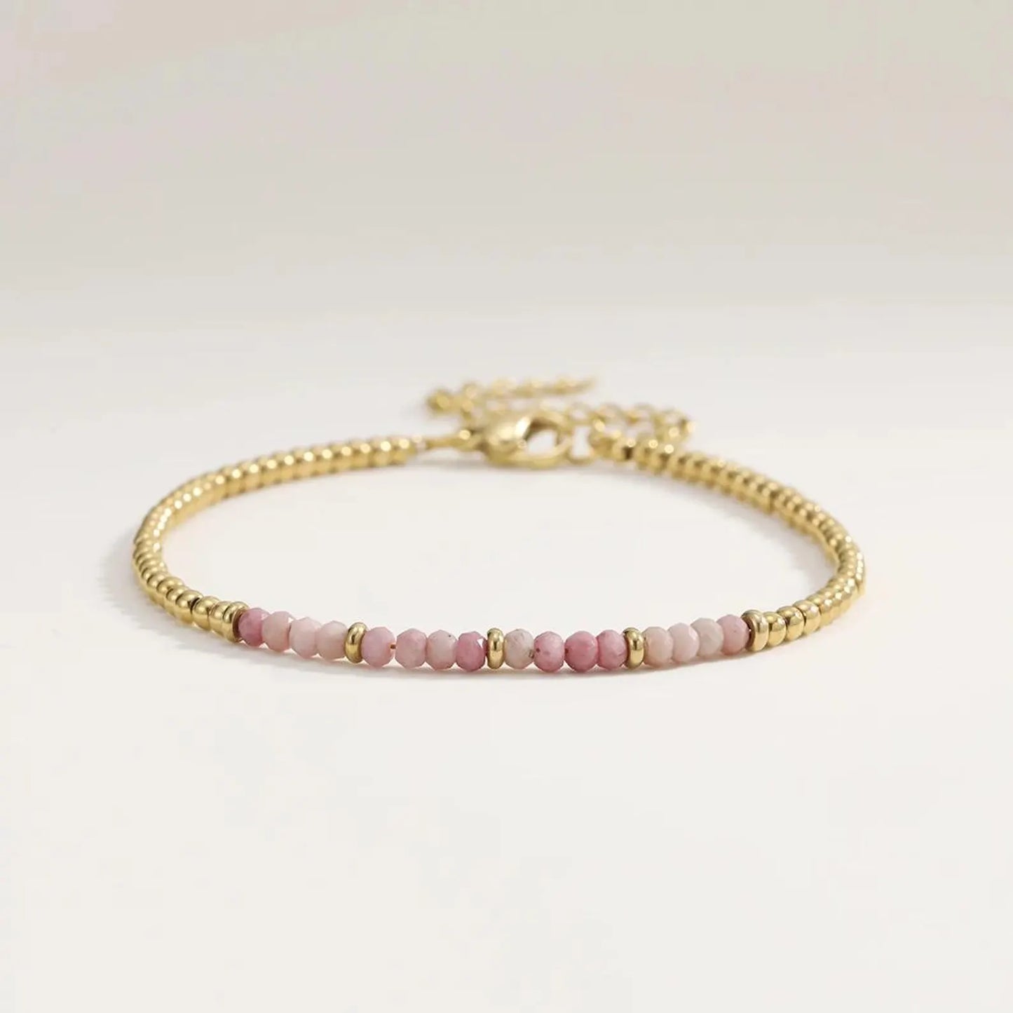 Gold and pink colored beaded bracelet