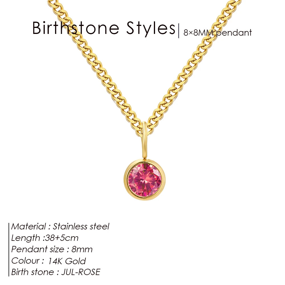 Gold necklace with a pink birthstone pendant on a white background