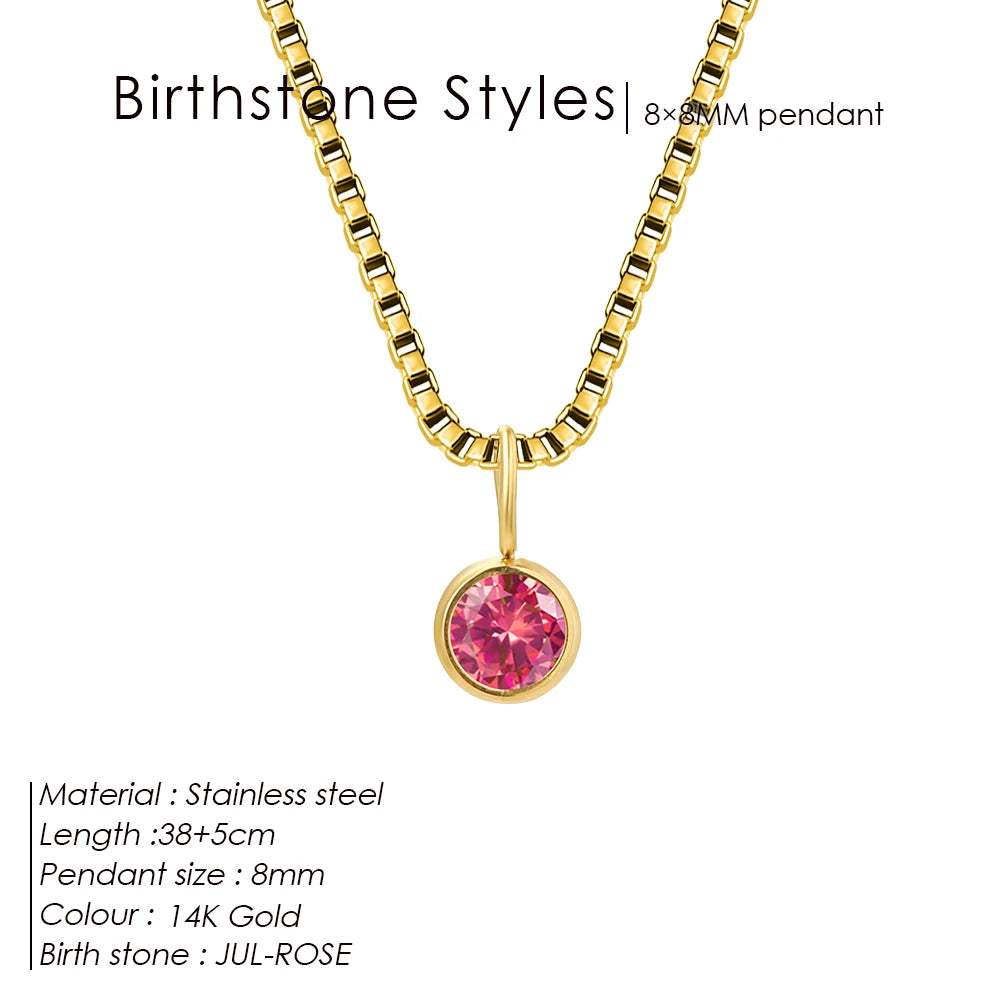 Gold necklace with a pink birthstone pendant on a white background
