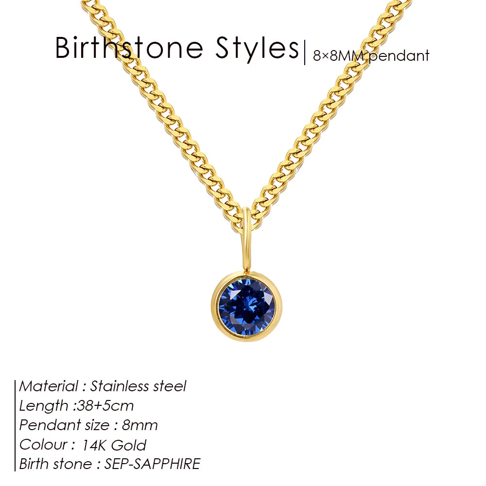 Gold necklace with a blue gemstone pendant on a white background