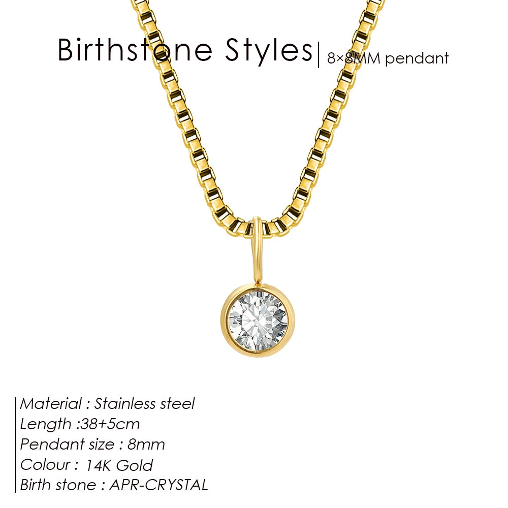 Gold necklace with a round pendant on a white background