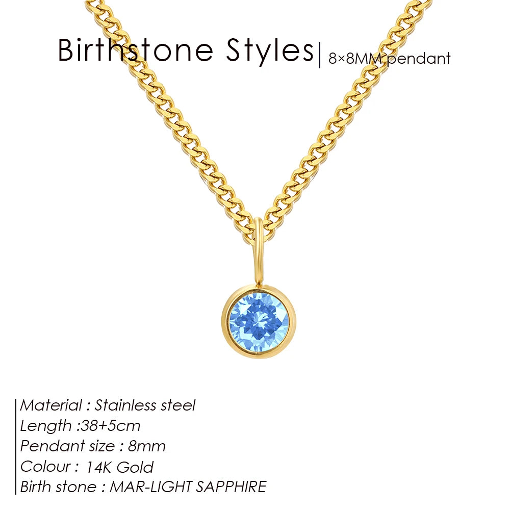 Gold necklace with a mar-light sapphire pendant on a white background